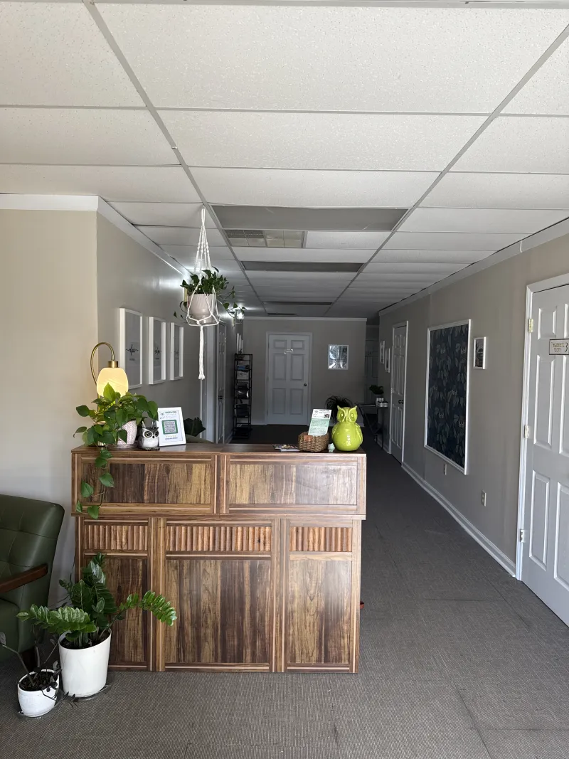 The Green Owl front desk and hallway